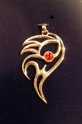 Elemental Goddess Pendant in Gold with a Red Sapphire