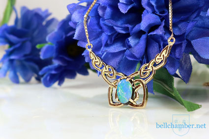 Celtic Moore's Loveknot pendant in gold set with Black Opal