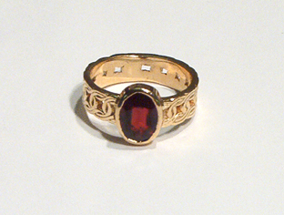 Colophon Celtic Ring with 12x10 Garnet.