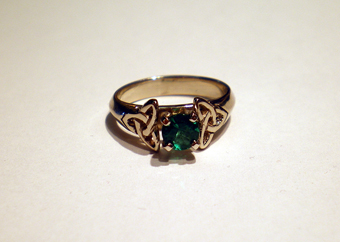 Double Triskele Ring in White Gold set with a 1/2 Carat Emerald