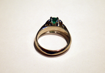 White Gold Triskele Ring set with an Emerald