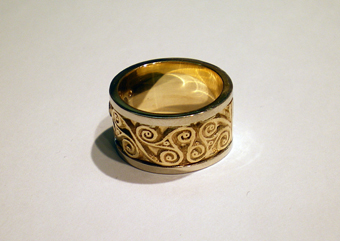 Amphreville Triskele Raised Motif in Yellow Gold with White Gold Flush Borders