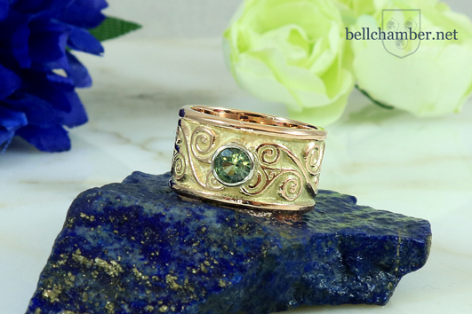 Celtic Eternity Spiral Amphreville with Green Sapphire