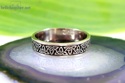 White gold ring Celtic Triquetra with dark backgound antiqued