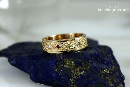 A yellow gold Celtic Birthstone/Family ring