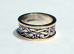 R86 Sterling Silver with raised Gold Borders.